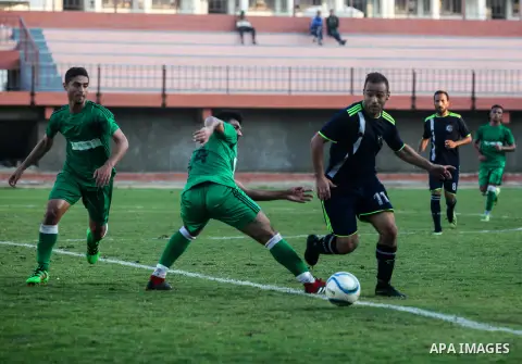 Palestinian football players of Al-Sadaqa club (green) and Al-Hilal (Dark blue) compete during match premier League in palestine stadium, in Gaza City on October 27, 2019. Photo by Mahmoud Ajjour