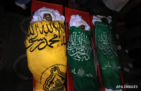 Mourners carry the bodies of Palestinians, during thier funeral in Gaza City, on November 13, 2019. Photo by Mahmoud Ajjour