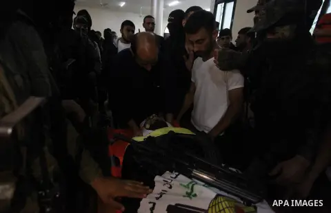 Relatives of Palestinian Yousef Abu Kamil, who was died hit by an Israeli airstrike, mourn over his body during his funeral in Gaza city on November 14, 2019. Photo by Mahmoud Ajjour