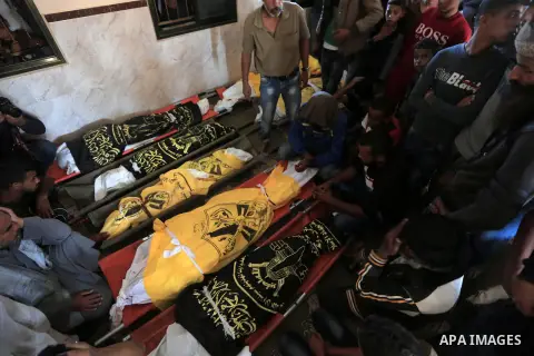 Palestinians pray on the bodies of members of Abu Malhous family during their funeral at a mosque in Deir al-Balah, central of Gaza Strip on November 14, 2019. Israel and the Palestinian militant group Islamic Jihad have...