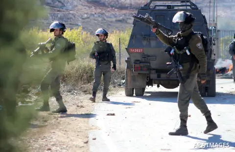 Israeli soldiers fire teargas, towards Palestinian protestors during clashes against the demolition of under-construction Palestinian houses by Israeli forces in Al-Aroub refugee camp, on November 19, 2019. Photo by Mosa...