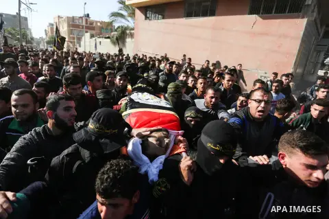 Mourners carry the body of Palestinian Rayid alsrsawy, 30, who was died of his wounds on 13 November 2019 during the recent escalation in Gaza, during his funeral in Gaza Strip, on November 29, 2019. Photo by Ashraf Amra