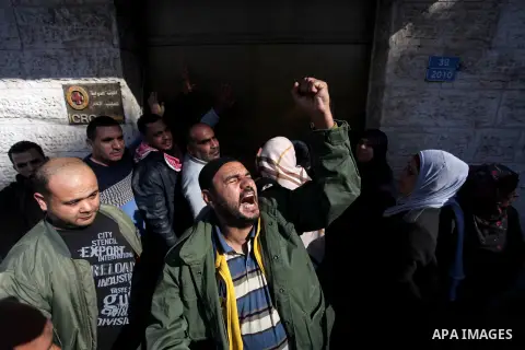Palestinians take part in a protest in solidarity with prisoners in Israeli jails, in front of the Red cross office, in Gaza city on December 02, 2019. Photo by Mahmoud Ajjour