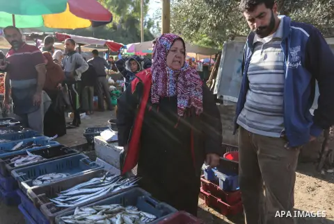 Palestinian fisherwoman Um Jimal al-Akra, selling fish at a market in Gaza City,on December 03, 2019. After she returns to Gaza City with fish, Um Jimal competes with other traders at the fishmarket in Deir Al Balah dist...