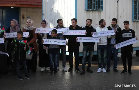 Palestinians take part in a rally demanding their rights on the occasion of the universal declaration of Human Rights in front of the office of the High Commissioner, in Gaza city, on December 10, 2019. Photo by Mahmoud...
