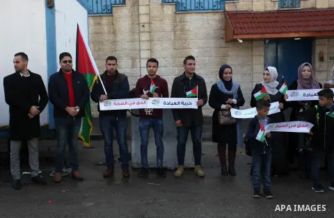 Palestinians take part in a rally demanding their rights on the occasion of the universal declaration of Human Rights in front of the office of the High Commissioner, in Gaza city, on December 10, 2019. Photo by Mahmoud...