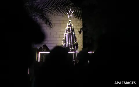Palestinian Christians attend Christmas Tree lighting ceremony at Latin church in Gaza city on December 14, 2019. Photo by Mahmoud Ajjour