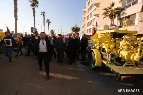 Qatar's Ambassador to the Palestinian Authority, Mohammed Al Emadi attends a ceremony to delivery vehicles and equipments with a donation from the State of Qatar for the benefit of the Palestinian Fire and Civil Defense...