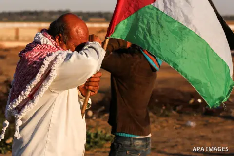 Palestinian protesters clash with Israeli troops following the tents protest where Palestinians demand the right to return to their homeland at the Israel-Gaza border, in Khan Younis in the southern Gaza Strip, on Decemb...