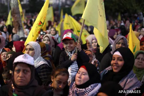 Palestinian supporters of the Fatah movement take part during a rally marking the fifty-fifth anniversary of the creation of the political party, in Gaza city on December 31, 2019. Photo by Mahmoud Ajjour