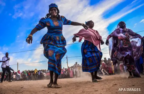 A picture taken on December 26, 2019, show Members of a Nubian singing and dance group perform "alkering dance" at the Nuba Mountains, sudan. Photo by faiz Abu bakr