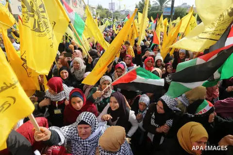Palestinian supporters of the Fatah movement take part during a rally in Gaza City on January 01, 2020, marking the 55th anniversary of the creation of the political party. Photo by Ashraf Amra