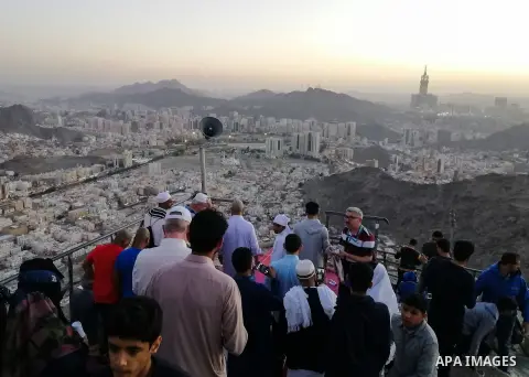 Muslim pilgrims pray at Mount Al-Noor during the Umrah pilgrimage rite in the holy city of Mecca, Saudi Arabia, on January 24, 2020. Mount Al-Noor houses Ghar-E-Hira or Hira cave, where Prophet Mohammad is said to have s...