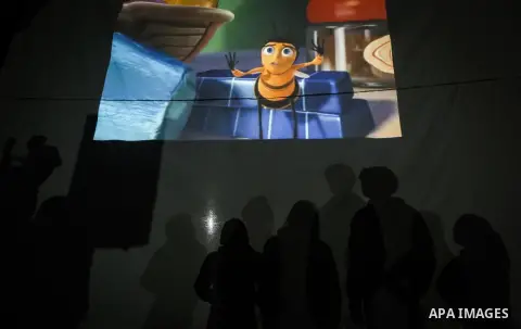 Palestinian children watch a movie during an event called "Cinema Camp" organised by Palestinian activists in al-Nusirat refugee camp in the central Gaza strip on January 27, 2020. Photo by Mahmoud Ajjour
