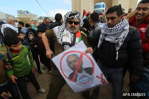 Palestinian demonstrators chant slogans during a protest against US President Donald Trump's expected peace plan in Rafah in the southern of Gaza Strip on January 28, 2020. Photo by Ashraf Amra