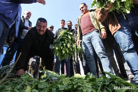 Palestinian farmers take part in a protest against the spraying pesticides on agricultural crops by Israeli air, in Gaza City on February 6, 2020. Photo by Mahmoud Ajjour