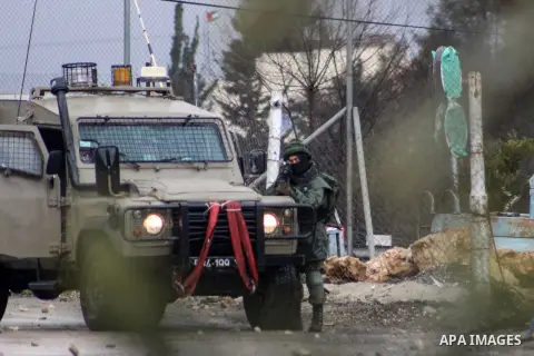 Israeli security forces take position during clashes with Palestinian protesters following a demonstration against US President Donald Trump's Century Deal "expected peace plan" in Arroub refugee camp north of the West B...