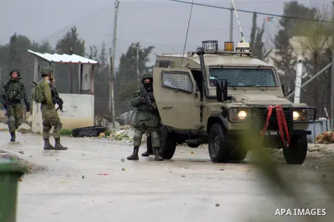 Israeli security forces take position during clashes with Palestinian protesters following a demonstration against US President Donald Trump's Century Deal "expected peace plan" in Arroub refugee camp north of the West B...