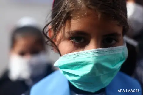 Palestinian childern take part in a rally to support with people in China suffering from the Corona virus, in Gaza city, on February 16, 2020. China has more than 80 running or pending clinical trials on potential treatm...