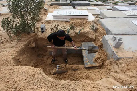 Palestinians build the cemeteries, at a cemeterie of Beit Lahia, in the northern Gaza Strip, on February 26, 2020. A cemetery or graveyard is a place where the remains of dead people are buried or otherwise interred. Pho...