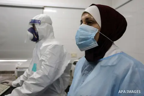 Palestinian Laboratory Medicine Specialist, tests vials of samples for coronavirus at Medical Laboratory, in Gaza city on March 15, 2020. For most people, the new coronavirus causes only mild or moderate symptoms. For so...