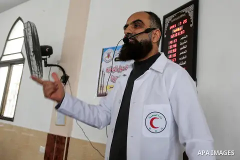 A Palestinian doctor gives advice to worshipers as a preventive measure amid fears of the spread of the novel coronavirus COVID-19 during a Friday sermon in a mosque in Khan Yunis in the southern Gaza Strip, on March 20,...