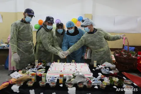Palestinians who were quarantined celebrate on the occasion of Mother's Day, as they stay at a school, in Dair Al Balah in the center of Gaza strip, March 21, 2020. Gazans may be trying to make light of coronavirus on so...