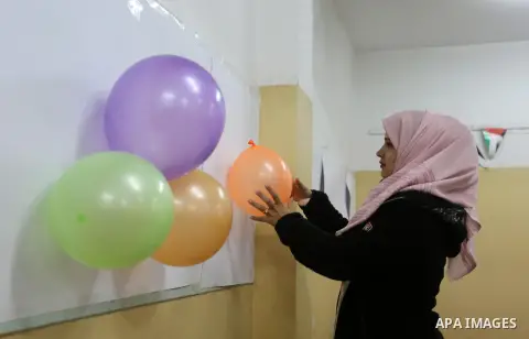 Palestinians who were quarantined stay at a school, in Dair Al Balah in the center of Gaza strip, March 21, 2020. Gazans may be trying to make light of coronavirus on social media, comparing lockdowns to the Israeli bloc...
