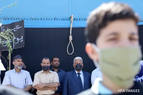 Children of Palestinians formerly employed by United Nations Relief and Works Agency (UNRWA) some wearing masks as a precaution against the spread of the coronavirus disease (COVID-19) take part in a protest demanding th...