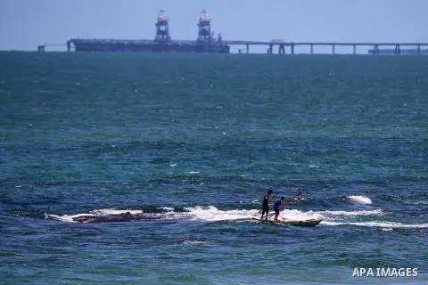Palestinians ride their boat during a sunny day in the Mediterranean Sea, in Gaza city, on May 31, 2020. Photo by Ashraf Amra