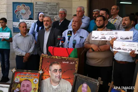 Palestinians take part in a protest to show soliadrity with prisoners in Israeli Jalis, on the occasion of the international anti-torture day, in Gaza city, on June 25, 2020. Photo by Mahmoud Ajjour