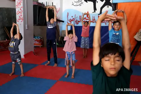 Palestinian boys perform yoga on International Yoga Day amid the coronavirus disease (COVID-19) crisis in a club in Gaza City June 25, 2020. Photo by Ashraf Amra