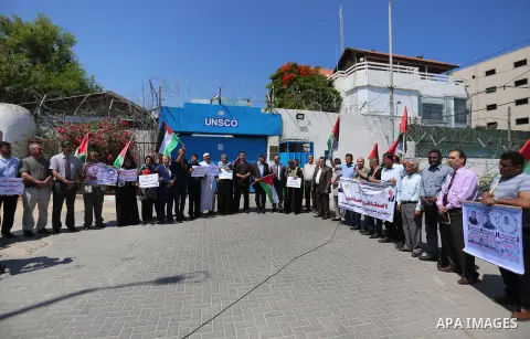 Palestinians take part in a protest against Israel's plan to annex parts of the occupied territory and against US President Donald Trump's Century Deal "expected peace plan", in front of the headquarter United Nation "UN...