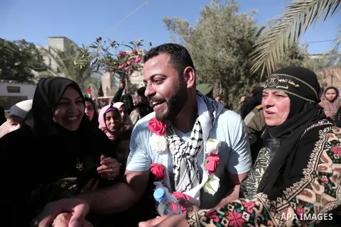 Freed Palestinian prisoner Iyad Al-Girjawi, 34, is welcomed by a relative upon his release from an Israeli jail, at his home in Khan Younis in the southern Gaza Strip, on July 2, 2020. Al-Girjawi served 9 years in the Is...