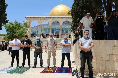 Palestinian Muslim worshippers perform the Friday prayer inside the al-Aqsa mosque compound, Islam's third holiest site, in Jerusalem's Old City on July 10, 2020. Photo by Muhammed Qarout Idkaidek