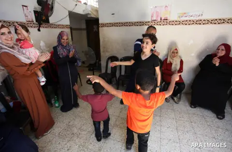 A Palestinian blind, high school, Aseel Al-Hajj Ahmed 92%, celebrates with her family after heard the results of her final exams known as ''Tawjihi'', in Jabalia northern Gaza Strip on July 11, 2020. Aseel suffering from...