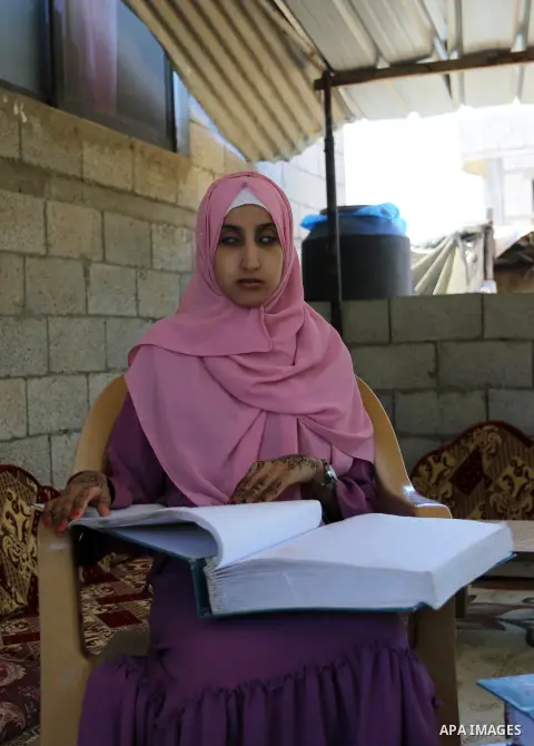 A Palestinian blind, high school female student, Shaima Abu Al-Hussain 93,3% reads Braille after heard the results of her final exams known as ''Tawjihi'', in Rafah in the of Gaza Strip, on July 12, 2020. Photo by Ashraf...