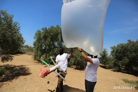 Palestinians prepare balloons attached with flammable materials at the Israel-Gaza border, in al-Bureij refugee camp in the center of Gaza Strip on August 10, 2020. Photo by Ashraf Amra