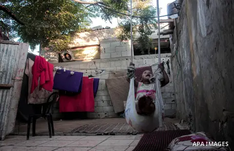 Palestinian poors react as they stay home during a lockdown following the outbreak of the coronavirus disease (COVID-19), in Gaza City September 2, 2020. Photo by Mohammed Salem