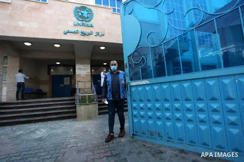 UNRWA employees wear face masks as the provide services for children in a clinic in Bureij refugee camp central of Gaza Strip on September 9, 2020. Photo by Mahmoud Ajjour