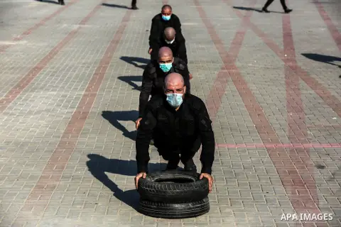Members of the Palestinian security forces wearing face masks, take part in a training session, to reinforce police forces to fight the spread of the coronavirus disease (COVID-19), in Gaza City on September 22, 2020. Ph...