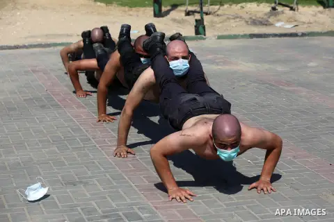 Members of the Palestinian security forces wearing face masks, take part in a training session, to reinforce police forces to fight the spread of the coronavirus disease (COVID-19), in Gaza City on September 22, 2020. Ph...