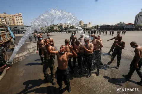 Members of the Palestinian security forces wearing face masks, take part in a training session, to reinforce police forces to fight the spread of the coronavirus disease (COVID-19), in Gaza City on September 22, 2020. Ph...