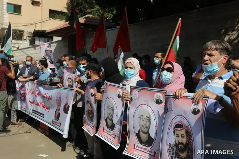 Palestinian supporters of the Popular Front for the Liberation of Palestine, take part in a protest to solidarity with prisoner Maher Al-Akhras on hunger strike helds in Israeli jails, in front of Red Cross office, in Ga...