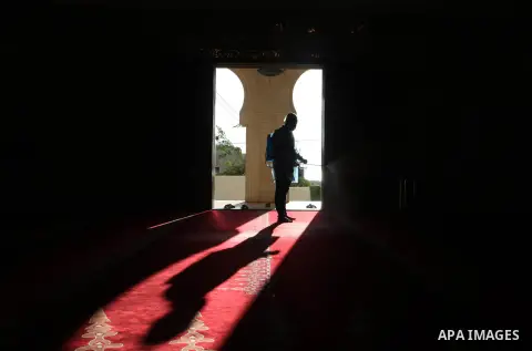 Palestinian workers disinfect a Mosque, as a preventive measure amid the coronavirus disease (COVID-19) outbreak, after the holy places reopen to worshippers to perform the weekly Islamic ritual, in Gaza city, on October...