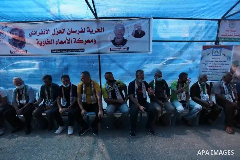 Palestinians take part in a protest to solidarity with prisoner Maher Al-Akhras on hunger strike helds in Israeli jails, in front of Red Cross office, in Gaza city, on October 19, 2020. Photo by Mahmoud Ajjour