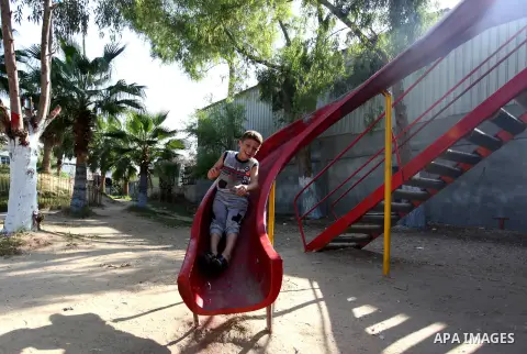 Palestinian volunteers paint and decorate the closed Municipal park, as a precaution against the spread of the coronavirus disease (COVID-19) in Gaza city, on October 27, 2020. Photo by Mahmoud Ajjour