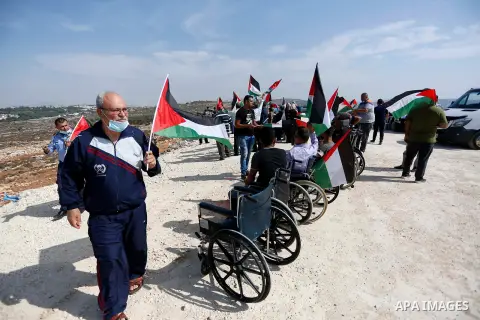 Handicapped Palestinian men on wheelchairs protest against an Israeli order to stop the building of a playing ground for them in the West Bank town of Saflit, near the Israeli settlement of Ariel, on October 28, 2020. Ph...