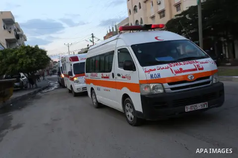 Palestinian ambulance men take part in an awareness campaign for drivers about the coronavirus disease (COVID-19), in Deir Al-Balah, in the central Gaza Strip, on November 28, 2020. Photo by Ashraf Amra