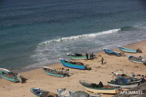 Palestinians fishermen ride their boat in Mediterranean Sea after the end of the closure period imposed on the Gaza Strip, in Deir Al-Balah in the center of the Gaza Strip on December 13, 2020, after the Ministry of Inte...